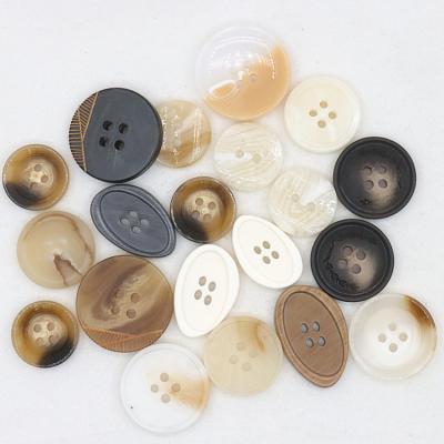 China Sustainable Manufacturers Custom 4 Hole Logo Engraved Mens And Womens Jackets Horns Plastic Resin Buttons for sale