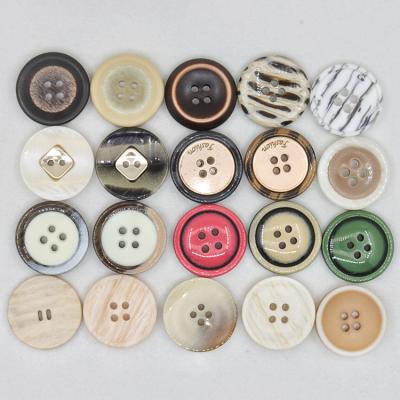 China Various Sustainable Custom 4 Hole Logo-Engraved Plastic Resin Buttons With Horns For Coats for sale