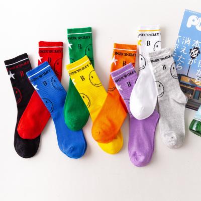 China Custom Pop Fashion Word Sock Crew Smile Happy Funny Face Antibacterial Antibacterial Jacquard Knit Socks For Women Girls for sale