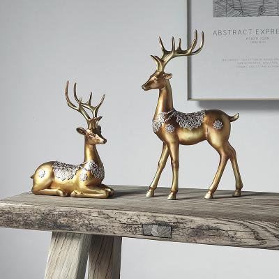 China Nordic Minimalist Elk Deer Table Ornaments For Living Room Decoration Gold Resin Standing Deer Stone Crafts for sale