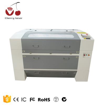 China laser engraving machine 690 6090 cnc laser cutter and 9060 laser engraver for making wood album for sale