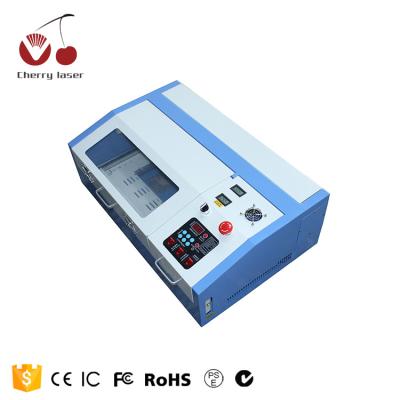 China Laser Engraving Desktop Laser Engraving Machine 3020 Laser Cutting Machine For Nonmetal 300*200mm for sale