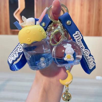 China Promotion Gift Bubble Bath Oil Doll Couples Floating Key Chain Cute Key Ring Car Pendant for sale