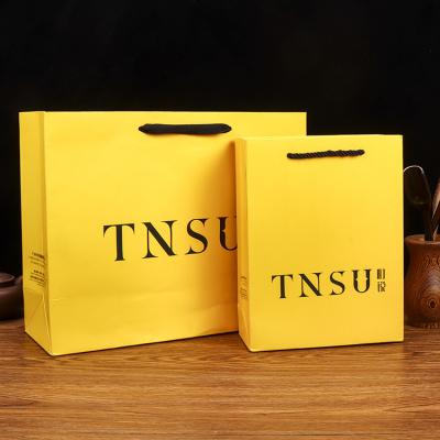 China Recycled Materials Customized Logo Design Luxury Paper Bags Gift Packaging Bags Craft Shopping Paper Bags With Handle for sale