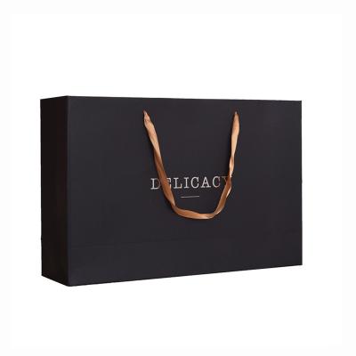 China Recyclable Luxury Customized Black Logo Paper Art Design Paper Gift Packaging Bag Gold Shopping Paper Bag With Ribbon Handle for sale