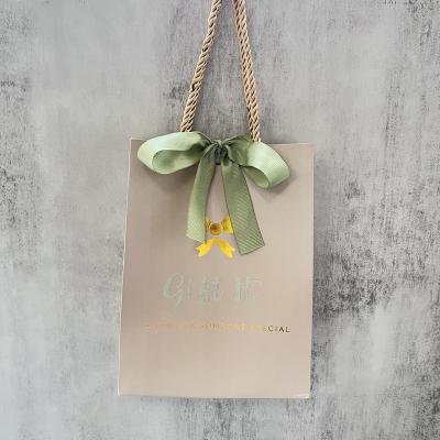 China Hot Foiled Luxury Custom Logo Recyclable Gold Gift Shopping Paper Bag With Handle For Gift Packaging Wedding Favor Wholesale Paper Bag for sale