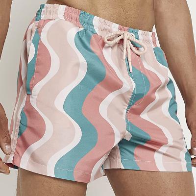 China Anti-Wrinkle OEM Customized Pattern Sport Wear All Over Wave Print Drawstring Swimming Beach Men's Shorts for sale