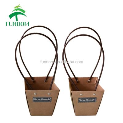 China New Hot Selling High Quality Innovative Fashionable Recyclable Folding Brown Kraft Paper Flower Gift Box With Long Handle for sale