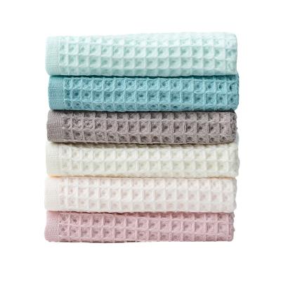 China Wholesale 100% Water Sustainably Absorbent Quick Dry Cotton Waffle Weave Spa Hand Towel Highly for sale