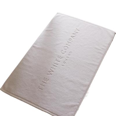 China Wholesale Custom Viable Logo Non Slip White Cotton Terry Jacquard Bath Mat For Hotel Spa Bathroom for sale