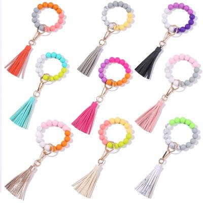 China Bag Charms Personalized Elastic Key Ring Leather Tassel Wristlet Bangle Beaded Silicone Key Chain For Women for sale