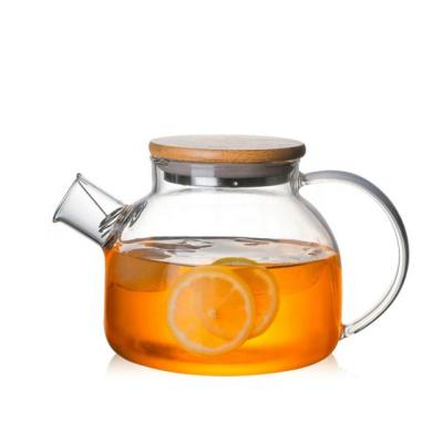 China Sustainable Hot Water Carafe Big Capacity Selling Jug Borosilicate Glass Water Jug With Bamboo Lid for sale