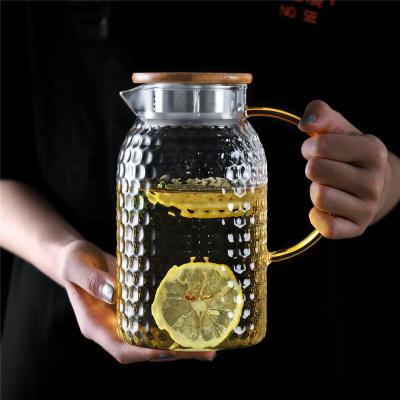 China Water Viable Heat Resistant Glass Pitcher Glass Jug Wate Grain Hammer Japanese Style Glass Jug With Handle for sale