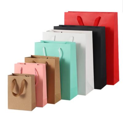 China Recycled materials wholesale paper bag elegant custom printed flat bottom paper bag beautiful party handle cardboard bags for sale