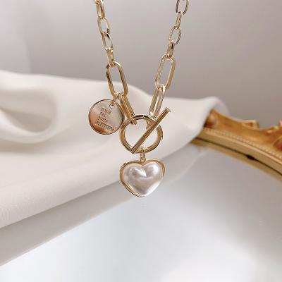 China Retro New Hop Pearl Love Design Niche Necklace Clavicle Chain Pendant Fashionable CLASSIC Female Light Luxury Hip for sale