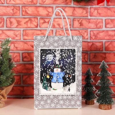 China Snowfall Lighting Christmas Giftware Resin Material Musical Handbag Decorating Lighting Indoor Christmas Decoration Christmas Lantern Snow Globe for sale