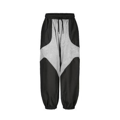 Cina Pantaloni da sci unisex con linee riflettenti completamente incollati in vendita