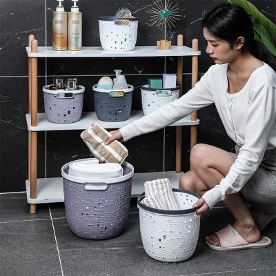 China Contemporary Portable Bathroom Plastic Hollow Out Laundry Storage Basket Organizer Kitchen Sundries Storage Basket for sale