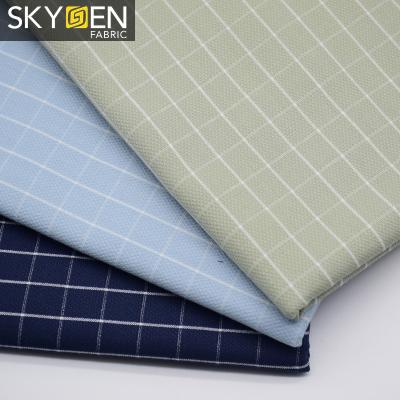 China New fashion cotton yarn jacquard windowpane check plaid anti-static dyed shirt fabric for sale