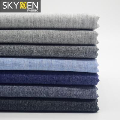 China Skygen Anti-Static Soft Plain Weave Shirting 100% Cotton Yarns Dyed Blue Gray Mix Color Yarn Shirting Fabric for sale