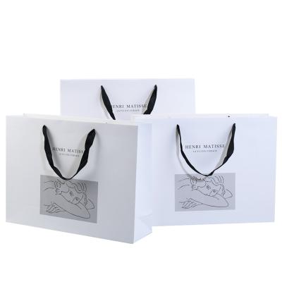 China Personality Recyclable Custom Printed Black Luxury Brand Clothing Retail Packaging Paper Bag With Logo for sale