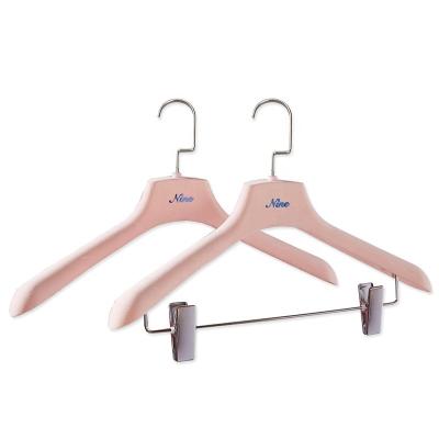 China Non-slip custom shop logo plastic pink velvet contact stitching clothing hangers for sale