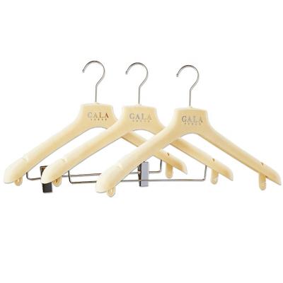 China Durable / Non Slip / Velvet Touch Clothes Hangers Custom Logo Plastic Velvet Suit Pants Hangers for sale