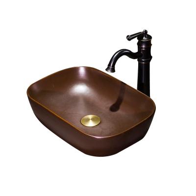 China 2020 Modern New Antique Brass Finish Bathroom Face Sink Glazed Ceramic Countertop Art Sink for sale