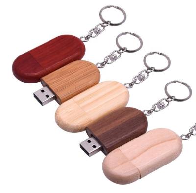 China Custom Silicone Oval Wooden USB Flash Memory Drives Wooden USB Flash Drive 3.0 Laser Engraved Wooden USB Key for sale