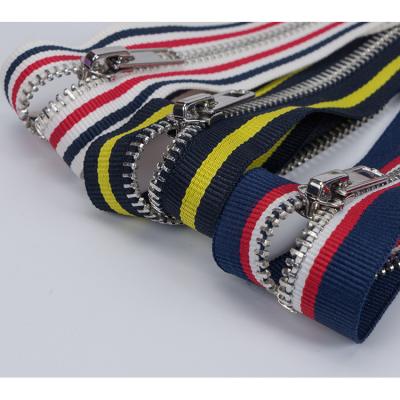 China 5#gold alloy zipper 5#gold copper color striped woven clothbelt long striped woven fabricbelt chain alloy striped lace zipper main bag jacket zipper for metal zipper for sale