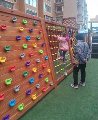 China Interesting Kindergarten Outdoor Climbing Wall For Kids Sports Wooden Climbing Game for sale