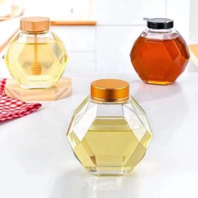 China Unique design food hexagon 500ml honey jar glass empty bottles with wooden cork lids for honey for sale