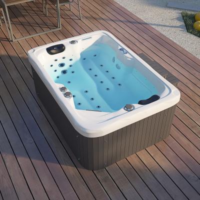 China Modern Simple White Center Drain Spa Bathtub 2 Person Acrylic Freestanding Lazy Hot Tub Spa for sale