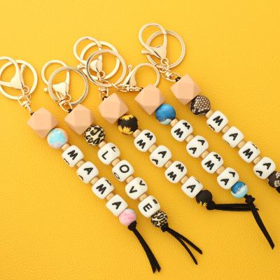 China Custom Mom Key Chain Wood Bead Silicone Bead Metal Mother's Day Gifts For Bag Accessories Letter Key Chain for sale