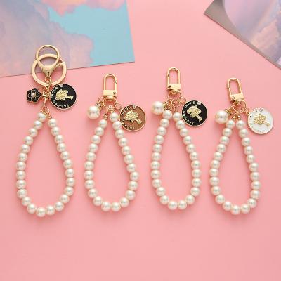 China Vintage Pearl Key Chain Alloy Letter Key Chain Diy Student Bag Pendant Mobile Phone Cute Punk Pearl Chain Pendant Chain for sale