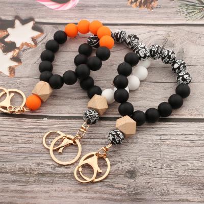 China Special Border New Silicone Bead Silicone Halloween Skull Bracelet Gift Wristband For Easter Pumpkin Key Chain for sale