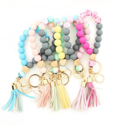 China Punk Handmade Silicone Beaded Keychains Cheap Custom Key Chains Logo Women Pu Tassel Wristlet Lanyard Keychain Wristband for sale