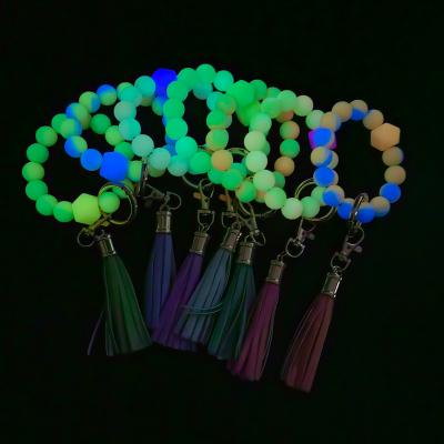 China Silicone/New Creative Colorful Silicone Plastic Beads Luminous Wristband Key Chain For Women Halloween Car Pendant Wristband Fluorescent Keychain for sale