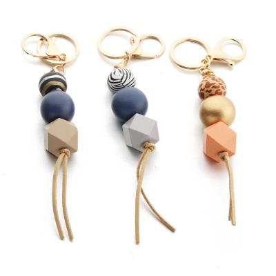 China Wooden Bohemian Rainbow Beaded Key Chain Wooden Silicone Beads Key Chain Tassel Mother's Day Gift Wooden Bead Pendant Key Chain for sale