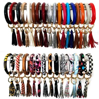 China 2022 Hot Selling Women's Leather Trim Round Bracelet Snakeskin Leather Rope Key Chain PU Bracelet Round Bracelets for sale