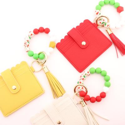 China Christmas Women Factory Wallet Bracelet Key Chain Leather Beaded Tassel Purse Coin Pouch Silicone Direct Anti-theft Card Holder for sale