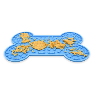 China XMZJ Amazon Hot Sale Food Grade Bone Shape Silicone Automatic Dog Licking Mat Easy To Clean Dog Lick Mat For Worry for sale