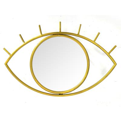 China Modern Gold Samll Quantity Eye Metal Frame Wall Mounted Mirror Decorative Shape Acceptable For Living Room for sale