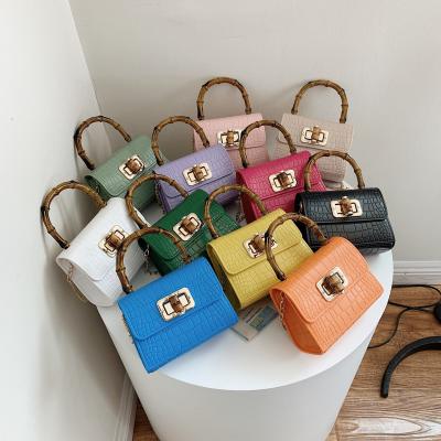 China 2021trending wholesale hot sale candy color mini fashion women's handbags chain cross - body bag ladies leather luxury handbags for girls for sale