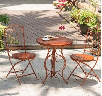 China Newdesign modern rustic wrought iron with wooden outdoor green table and chair garden decoration leisure table and chair for sale