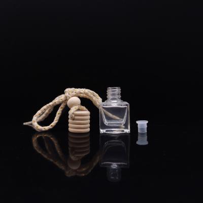 China Cosmetic Easy Carry 7ml Transparent Color Mini Glass Perfume Bottle Car Perfume Packaging for sale