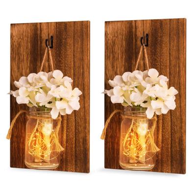 China Decorative Rustic Handmade Mason Jar Scone Wall Hanging with Fairy LED String Lights and Flowers for sale