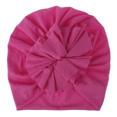 China Lovely Flowers Solid Color Newborn Kids Breathable Elastic Pink Infant Party Warm Hats And Turban Baby Hats For Sale for sale