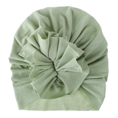 China Breathable Custom Design New Hot Sale Fancy Embroidered Cute Warm Cotton Knot Flower Solid Color Baby Elastic Turban Hats for sale