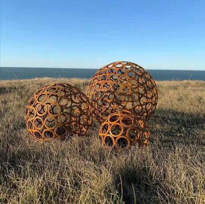 China Hollow Abstract Europe Large Sphere Sculpture Metal Corten Steel Sculpture For Outdoor Ornament for sale